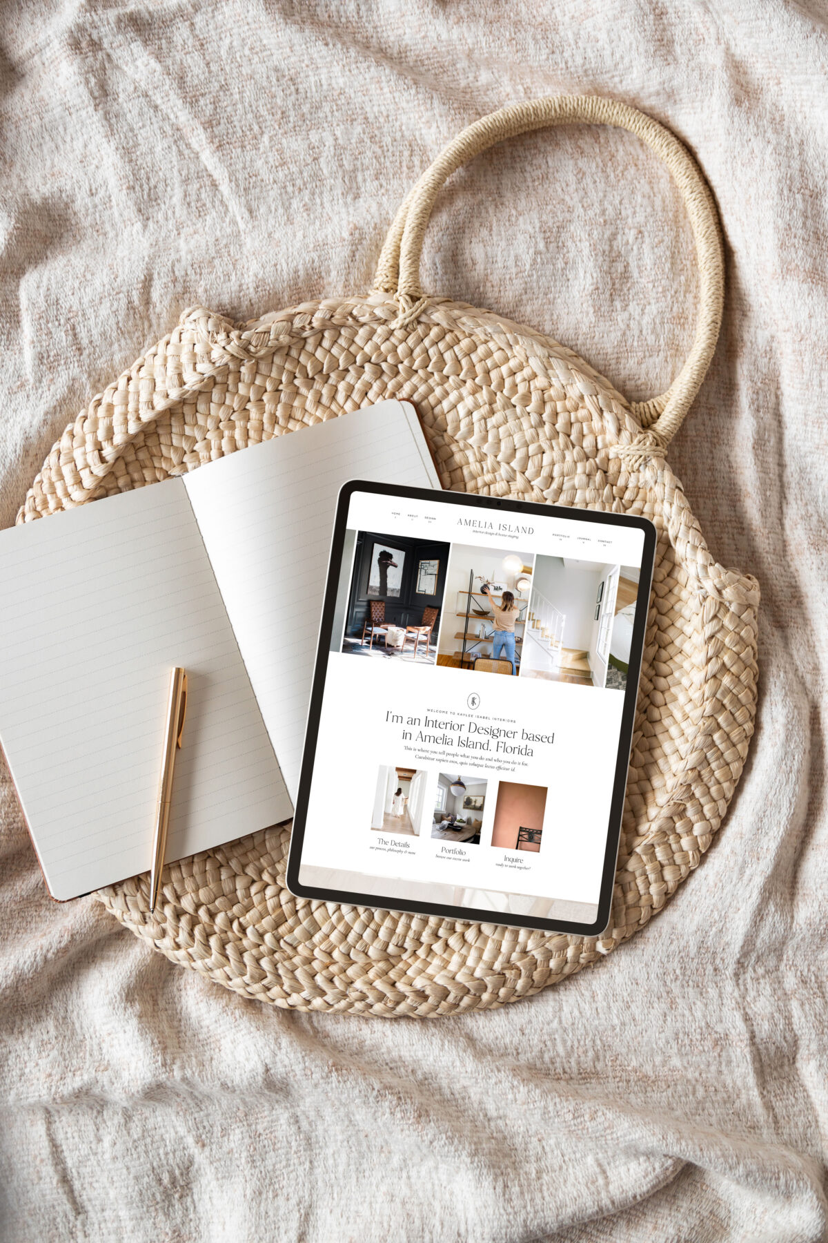 Flat-lay of a notebook, pen, and an iPad displaying a designer’s website on top of a woven tote—used in a blog post about common mistakes designers make.